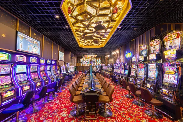 A close-up shot of golden coins falling around a spinning roulette wheel, representing immersive casino action at BDTJLL.